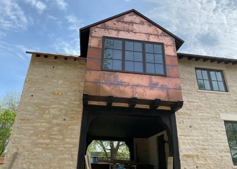 Copper metal panel facade on a stone building for Metal Roof Coating in Flatwoods